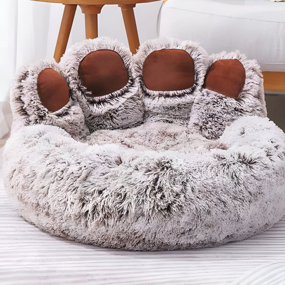 Cama para mascotas peluda en forma de pata